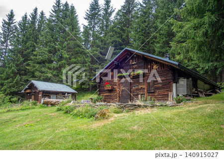 Traditional wooden chalet in forest Contamines Montjoie, France Traditional wooden chalet in forest Contamines Montjoie, France 140915027