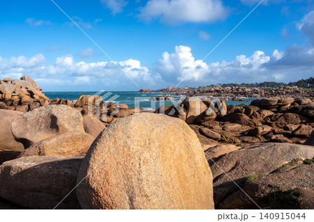 Granite chaos landscape facing Mean Ruz lighthouse in Tregastel, France Granite chaos landscape facing Mean Ruz lighthouse in Tregastel, France 140915044