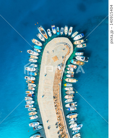Aerial view of boats and yachts in dock at sunset in summer Aerial view of boats and yachts in dock at sunset in summer 140915404
