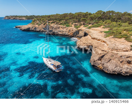 Aerial view of luxury yachts and boats on blue sea, island 140915466