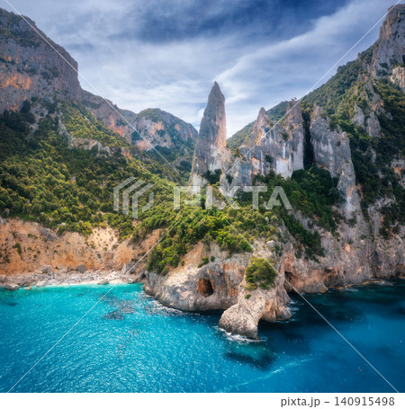 Aerial view of rocks and mountains, blue bay, beach, boats Aerial view of rocks and mountains, blue bay, beach, boats 140915498