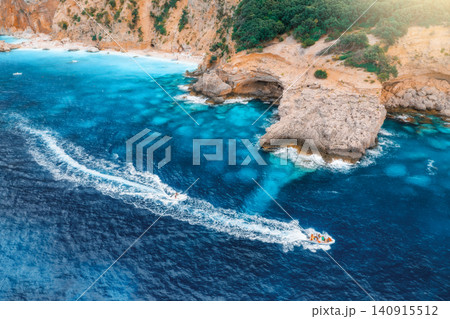 Aerial view of speed boats and sandy beach on sunny summer day 140915512