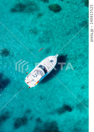 Aerial view of luxury yacht and boat in blue sea in summer Aerial view of luxury yacht and boat in blue sea in summer 140915525