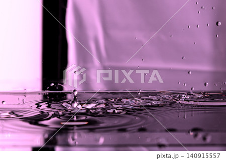 211.Mid-Air Droplets Splashing on Reflective Pink Water 140915557