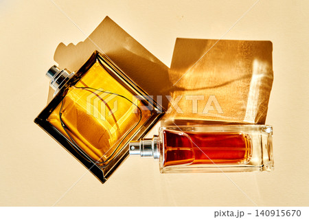 Perfume bottles creating elegant shadows and golden light Perfume bottles creating elegant shadows and golden light 140915670