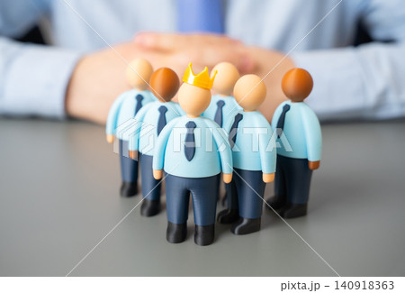 A leader with a crown and his subordinates on a team. The art of team management. Achievements in management. Authority and discipline. 140918363