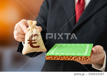 A plot of land and a euro money bag. Land purchase. Valuation. Leasing a plot of land for construction. A plot of land and a euro money bag. Land purchase. Valuation. Leasing a plot of land for construction. 140918367