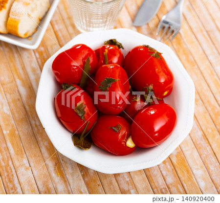 Vegetarian appetizer of homemade marinated tomatoes on plate 140920400