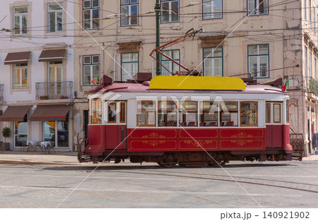 Historic yellow and red tram on city street in Lisbon, Portugal Historic yellow and red tram on city street in Lisbon, Portugal 140921902