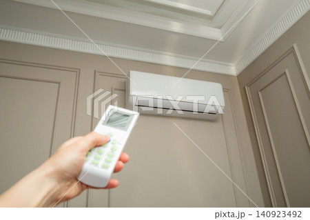 Air conditioner cools indoor environment. Comfort and modern technology concept 140923492