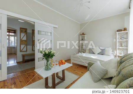 Studio Apartment Interior with Living Zone and Bed View Studio Apartment Interior with Living Zone and Bed View 140923701