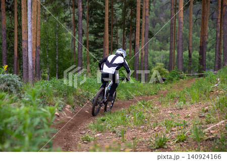 Back view downhill racer riding 140924166