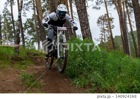 Athlete racer riding downhill 140924168