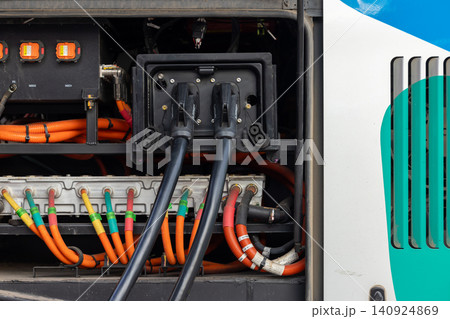 Electric bus at the EV charging station, Industrial battery storage energy of electric bus, Electric bus charging station, Battery electric bus. Electric bus at the EV charging station, Industrial battery storage energy of electric bus, Electric bus charging station, Battery electric bus. 140924869