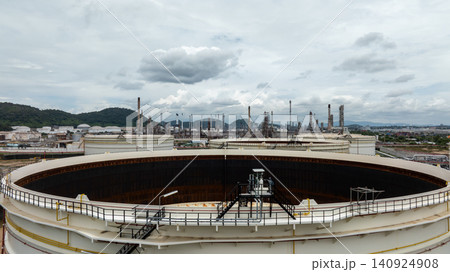 Aerial view oil storage tank, White oil tank storage chemical petroleum petrochemical refinery product at oil terminal, Business commercial trade fuel energy transport. Aerial view oil storage tank, White oil tank storage chemical petroleum petrochemical refinery product at oil terminal, Business commercial trade fuel energy transport. 140924908