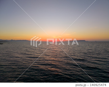 Scenic Aerial View of Sunset Over Mediterranean Sea in Crete 140925474