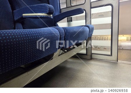 Comfortable Blue Seating in Modern Train Compartment for Relaxed Travel Experience Comfortable Blue Seating in Modern Train Compartment for Relaxed Travel Experience 140926938