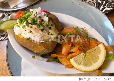 Gourmet Baked Potato with Cream Cheese and Smoked Salmon Culinary Delight for Food Presentation and Dining Concepts Gourmet Baked Potato with Cream Cheese and Smoked Salmon Culinary Delight for Food Presentation and Dining Concepts 140926947