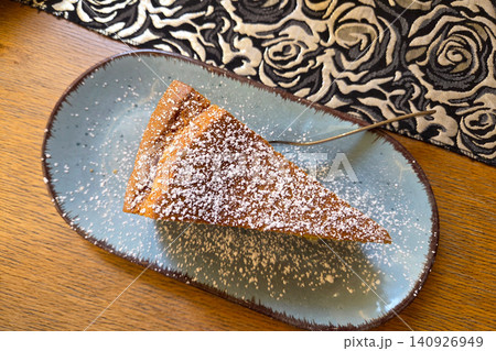 Slice of Delicious Homemade Cake on a Blue Plate for Dessert Inspiration 140926949