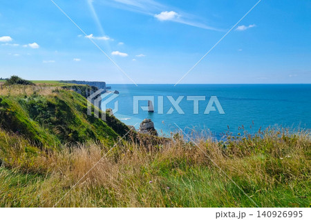 Scenic Coastal Cliffs and Ocean View Under Clear Blue Skies Scenic Coastal Cliffs and Ocean View Under Clear Blue Skies 140926995