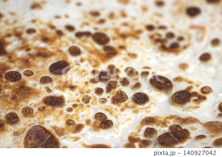 Close-Up of Golden Brown Crepe Pancake Surface Texture Close-Up of Golden Brown Crepe Pancake Surface Texture 140927042