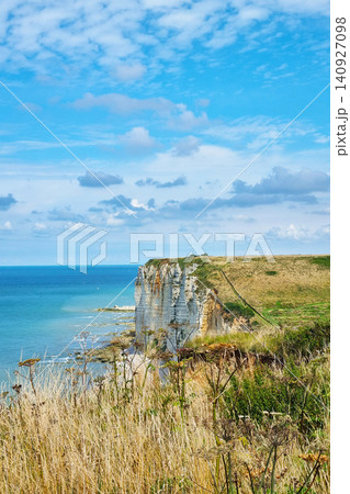 Scenic Coastal Cliff View under Clear Blue Sky by the Ocean 140927098
