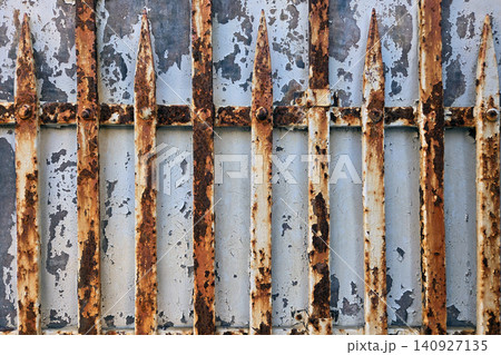 Rusty metal gates in an old building showing wear and tear over time 140927135