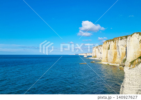 Majestic Coastal Cliffs Overlooking Blue Ocean on Sunny Day Majestic Coastal Cliffs Overlooking Blue Ocean on Sunny Day 140927627