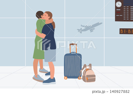 Airport Hug. Two Friends Meeting with Luggage Airport Hug. Two Friends Meeting with Luggage 140927882