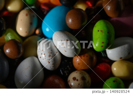 Explore the vibrant world of colorful candy-coated treats in a delightful assortment of shapes and sizes 140928524