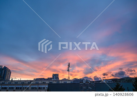 Sunset over city skyline with vibrant twilight colors Sunset over city skyline with vibrant twilight colors 140928606