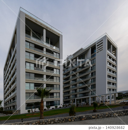 Modern architecture in a tranquil setting with striking minimalist design and lush landscaping Modern architecture in a tranquil setting with striking minimalist design and lush landscaping 140928682