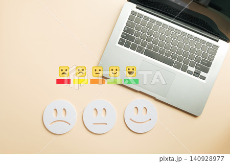 Customer feedback online review shows satisfaction assessment with digital emoji scale, multiple rating options, happy and sad faces for client survey, laptop user experience setup Customer feedback online review shows satisfaction assessment with digital emoji scale, multiple rating options, happy and sad faces for client survey, laptop user experience setup 140928977