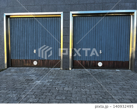 Closed Garage Gates in Modern Building Closed Garage Gates in Modern Building 140932495