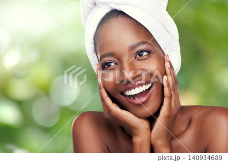 Woman, skincare and thinking of beauty on a green background with towel for dermatology and wellness. Facial of a young model or African person with smile for organic and vegan cosmetics in nature Woman, skincare and thinking of beauty on a green background with towel for dermatology and wellness. Facial of a young model or African person with smile for organic and vegan cosmetics in nature 140934689