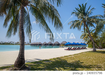 Over water bungalows with steps into amazing lagoon Over water bungalows with steps into amazing lagoon 140935796