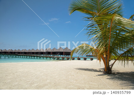 Over water bungalows on a tropical island Over water bungalows on a tropical island 140935799