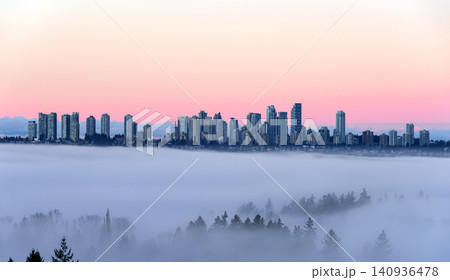 Metrotown Cityscape with Skyscrapers Flying in the Sky. Rising Above a Dense Low Fog Metrotown Cityscape with Skyscrapers Flying in the Sky. Rising Above a Dense Low Fog 140936478