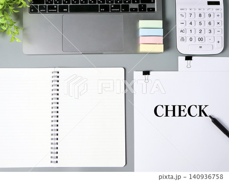 CHECKをイメージしたノートパソコンとノート・電卓のビジネス素材 CHECKをイメージしたノートパソコンとノート・電卓のビジネス素材 140936758