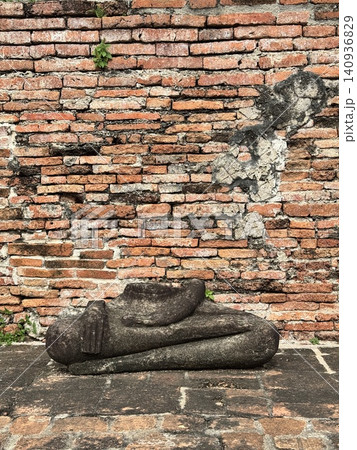 Ancient Seated Buddha Lap And Hands Relic On Brick Floor Ancient Seated Buddha Lap And Hands Relic On Brick Floor 140936829