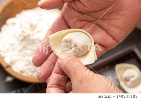 handmade Wonton Wrapping Process, Traditional Chinese Dumpling Making handmade Wonton Wrapping Process, Traditional Chinese Dumpling Making 140937185