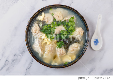 beef Wontons in Water Chestnut Soup, Traditional Chinese Dumpling Soup beef Wontons in Water Chestnut Soup, Traditional Chinese Dumpling Soup 140937252