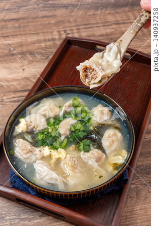 beef Wontons in Water Chestnut Soup, Traditional Chinese Dumpling Soup beef Wontons in Water Chestnut Soup, Traditional Chinese Dumpling Soup 140937258