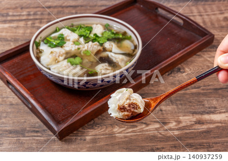 beef Wontons in Water Chestnut Soup, Traditional Chinese Dumpling Soup beef Wontons in Water Chestnut Soup, Traditional Chinese Dumpling Soup 140937259