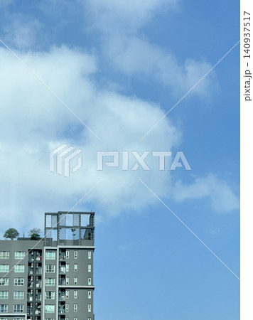 Minimalist Crop Of Contemporary Condominium Facade Against Sky. Minimalist Crop Of Contemporary Condominium Facade Against Sky. 140937517