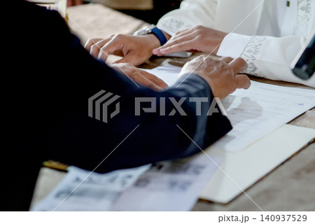 Islamic Marriage Contract Ceremony (Akad Nikah) - Religious Officiant Joining Hands with Groom During Ijab Qabul Ritual Islamic Marriage Contract Ceremony (Akad Nikah) - Religious Officiant Joining Hands with Groom During Ijab Qabul Ritual 140937529