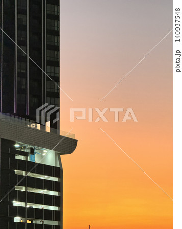 Low Angle Skyscraper Architecture Silhouette Under Colorful Evening Sky Low Angle Skyscraper Architecture Silhouette Under Colorful Evening Sky 140937548