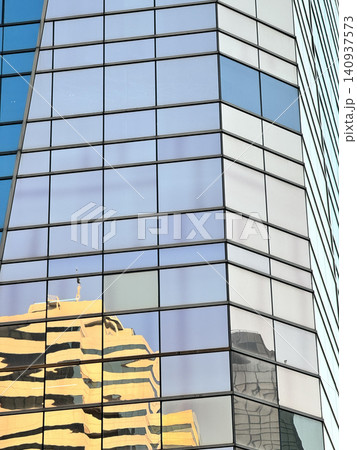 High Angle Perspective Of Glass Architecture With Yellow Reflection High Angle Perspective Of Glass Architecture With Yellow Reflection 140937573