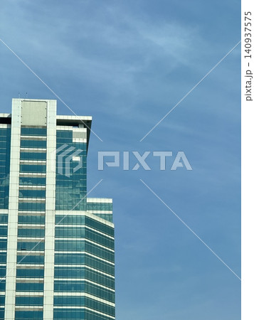 Low Angle Frame Of Modern Glass Curtain Wall Skyscraper 140937575