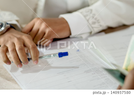 Close-Up of Marriage Certificate Pages During Religious Ceremony 140937580